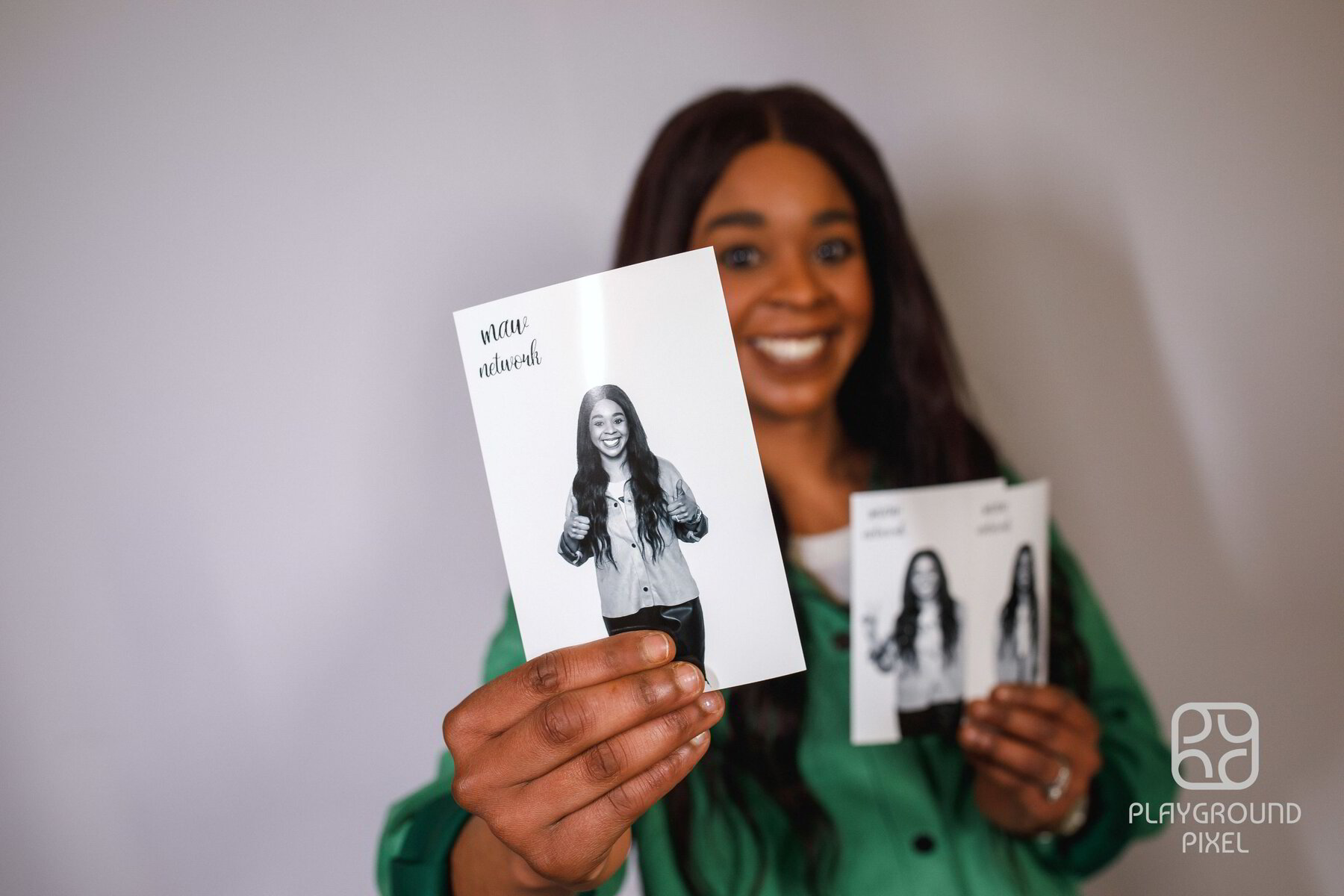 Guest holding a black and white photo booth print
